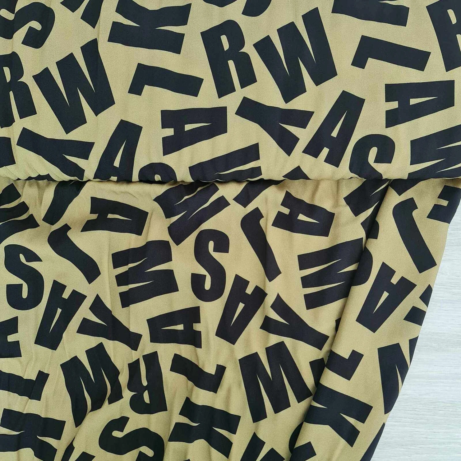 European Woven Viscose, Oeko-Tex, Bold Letters Light Olive 1 European Woven Viscose, Oeko-Tex, Bold Letters Light Olive